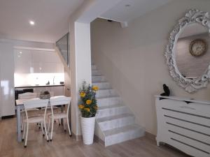 a stairway with a table and a mirror at la herencia B VUT 1693 in Ponferrada +45 photos