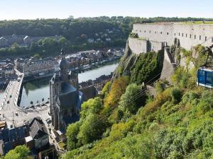 a view of a river and a castle at ibis budget Givet in Givet