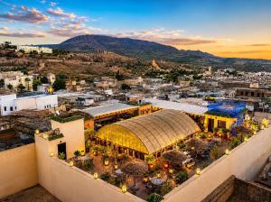 an aerial view of a city with a building at Riad Fes Palais Bab Sahra Suites & Cooking Workshops in Fez