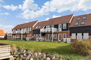 a building with a lawn in front of it at 4170-Borre-Klintholm-Havneby-70 in Borre