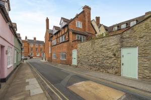 an empty street in an old city with brick buildings at 2 Bed in Ludlow oc-78885 in Ludlow