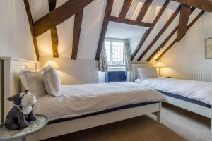 a bedroom with two beds and a teddy bear at 2 Bed in Ludlow oc-78885 in Ludlow