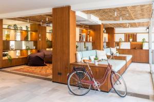a bike parked in a room with a bedroom at INNSiDE by Meliá Alcudia in Port d'Alcudia
