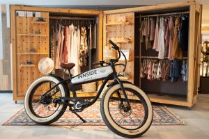 a bike parked in front of a clothing store at INNSiDE by Meliá Alcudia in Port d'Alcudia +102 photos