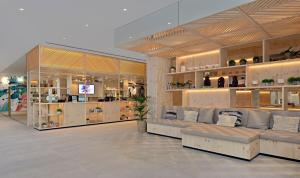 a store with couches and shelves in a room at INNSiDE by Meliá Calviá Beach in Magaluf +56 photos