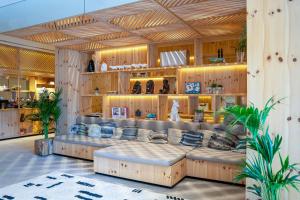 a store with couches in the middle of a room at INNSiDE by Meliá Calviá Beach in Magaluf