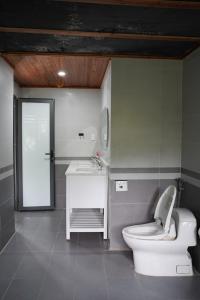 a bathroom with a toilet and a sink at Laman Riverside in Nguyên Ngoại +46 photos