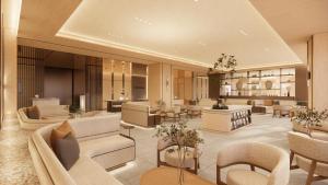 a hotel lobby with couches and tables and chairs at UH Continental SeoulCenter in Seoul
