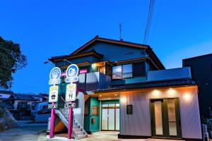 a building with a bunch of signs in front of it at STEP by STEP - Vacation STAY 25753v in Kanayama +23 photos