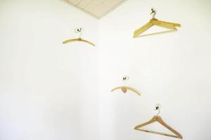 a group of hangers hanging on a wall at 15524-Farevejle-Lynghoj-5 in Fårevejle