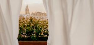 a view from a window with a white curtain at Hotel Colón, a Gran Meliá Hotel - The Leading Hotels of the World in Seville