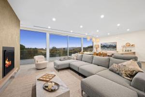 a living room with a couch and a fireplace at Casa Lux in Aireys Inlet