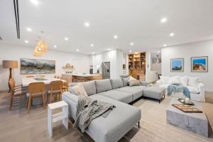 a living room with a couch and a table at Casa Lux in Aireys Inlet