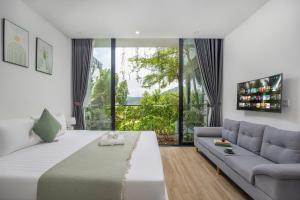 a living room with a large bed and a couch at Luxury Mountain View 3BR Villa Pool 10ppl in Phúc Yên +41 photos