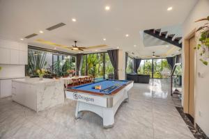 a pool table in the middle of a room at Luxury Mountain View 3BR Villa Pool 10ppl in Phúc Yên