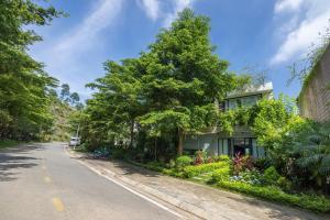 an empty street with a house and trees at Luxury Mountain View 3BR Villa Pool 10ppl in Phúc Yên