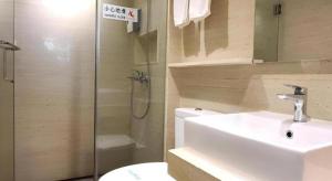 a bathroom with a toilet and a sink and a shower at Hong Thai Hotel in Macau +68 photos