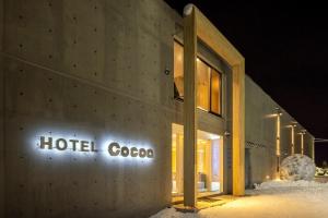 a hotelcooco sign on the side of a building at night at Hotel Cocoa - Vacation STAY 05828v in Sakura +17 photos