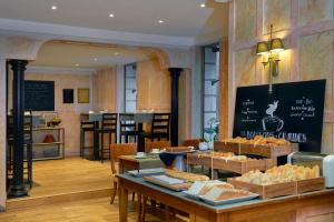 a bakery with a table with food on it at Meliá Paris Vendôme in Paris