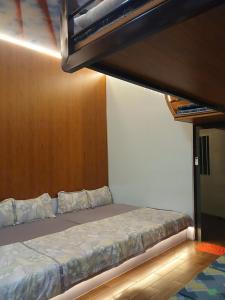 a bed in a room with a bunk bed at paparazzi homestay in Xuyên Mộc