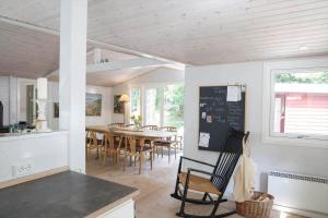 a kitchen and dining room with a table and chairs at 10033-1-Rorvig-Hjortevej-17 in Rørvig +18 photos