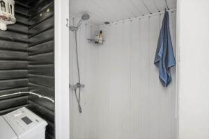 a bathroom with a washing machine and a towel at FJ1401-Jaegerspris-Hovdiget-5 in Jægerspris