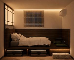 a bedroom with a bed with white sheets and a window at Stay Damyeon in Seoul