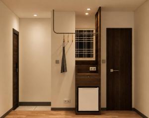 a kitchen with a refrigerator and a door at Stay Damyeon in Seoul