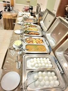 a buffet line with many different types of food at Hotel Housez 43 in Kolkata +19 photos