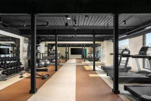 a gym with lots of treadmills and weights at Caption By Hyatt Chattanooga Downtown in Chattanooga