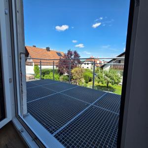 a view of a tennis court from a window at schöne Neubau Ferienwohnung "Wiesent" mit Küche und Balkon in Forchheim