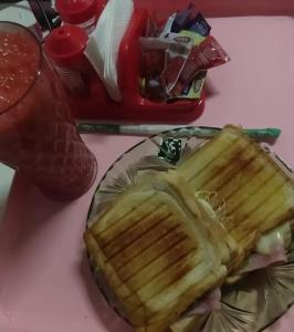 a plate of food with a sandwich on a table at Vamos lá in Caxias das Aldeias Altas +1 photo
