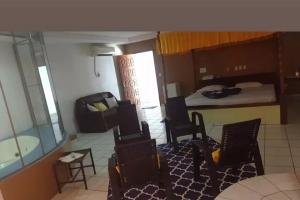 a living room with a bed and a room with a bedroom at Vamos lá in Caxias das Aldeias Altas