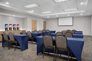 a conference room with blue tables and chairs at Hampton Inn & Suites Lake City in Lake City +39 photos