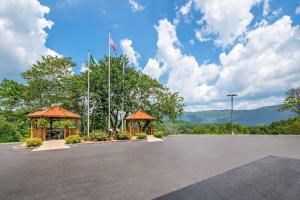 a parking lot with a gazebo and a flag at Quality Inn & Suites Big Stone Gap in Big Stone Gap