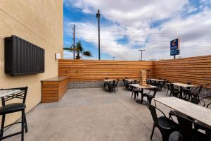 a patio with tables and chairs in a restaurant at MainStay Suites El Centro I-8 in El Centro