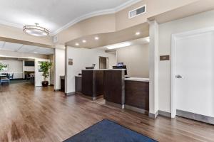 an office with a reception desk and a lobby at Comfort Inn & Suites Red Deer - Highway 11 in Red Deer
