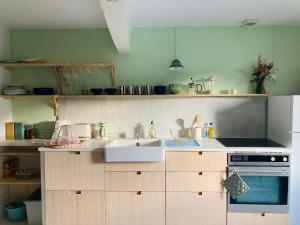 a kitchen with a sink and a stove at Home in Drome provençale in Vesc