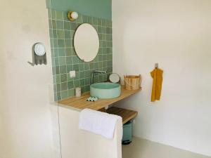 a bathroom with a sink and a mirror at Home in Drome provençale in Vesc +9 photos