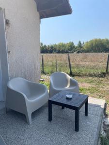 two chairs and a coffee table on a patio at Préchacq-les-Bains in Préchacq