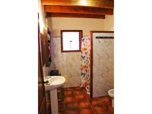 a bathroom with a sink and a shower at Casa Rural los Ajaches in Yaiza +13 photos