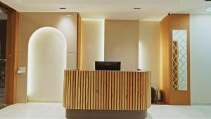 a lobby with a desk with a computer on it at Hotel Pinaki Inn in Ujjain
