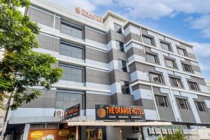 a building with a sign in front of it at The Orange Hotel in Visakhapatnam