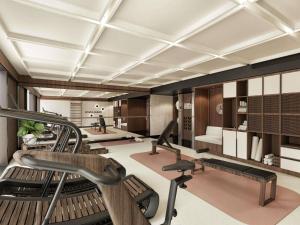 a gym with treadmills and elliptical machines at Novotel Lviv Center in Lviv