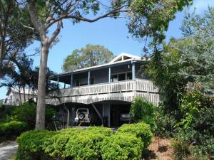 a house with a wrap around porch at Bellevue Holiday House Crescent Head in Crescent Head