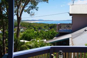 a view of the ocean from the balcony of a house at Bellevue Holiday House Crescent Head in Crescent Head +4 photos
