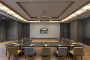 a conference room with a large table and chairs at Park James in Menlo Park
