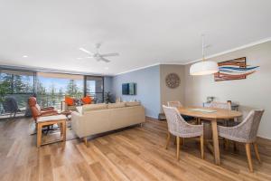 a living room with a couch and a table at Flightdeck 301, Clarence Street in Port Macquarie