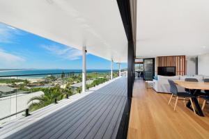 an open living room with a view of the ocean at La Mer, 19 Dulconghi Street in Crescent Head