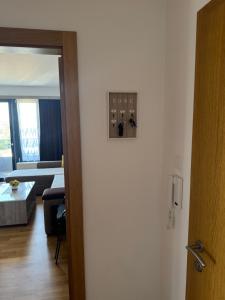 a door to a room with a living room at APARTMaN HAPPY PLACE in Soko Banja